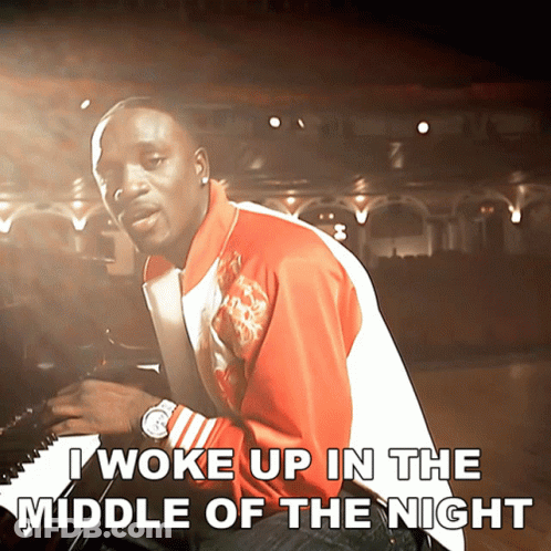 A Man Playing A Piano With The Words I Woke Up In The Middle Of The Night GIF