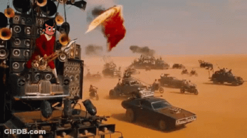 A Man Playing A Saxophone In The Middle Of A Desert With Cars In The Background GIF