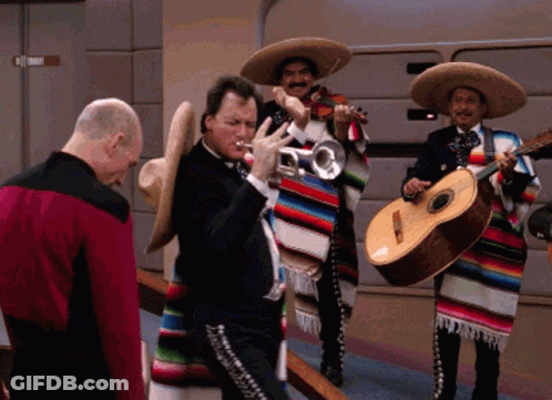A Man Playing A Trumpet And A Man Playing Guitar GIF