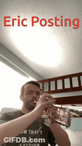 A Man Playing A Trumpet With The Name Eric Posting Written Above Him GIF