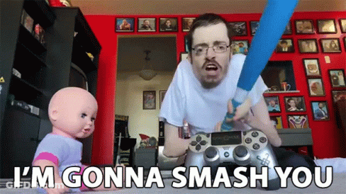 A Man Playing A Video Game With The Words I 'M Gonna Smash You Behind Him GIF