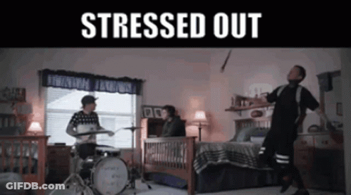 A Man Playing Drums In A Bedroom With The Words " Stressed Out " GIF