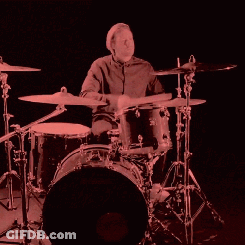 A Man Playing Drums With A Drum Set That Says Yamaha GIF