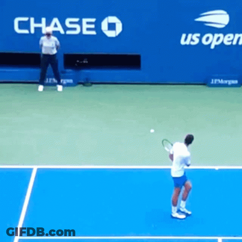 A Man Playing Tennis In Front Of A Chase Advertisement GIF