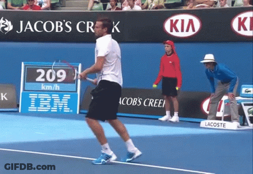 A Man Playing Tennis On A Court With Jacob 'S Creek In The Background GIF