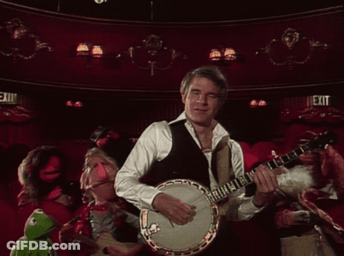Man Playing Banjo In Front Of Exit Sign GIF