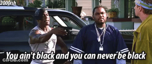 A Man Pointing A Gun At Another Man With The Words You Ain 'T Black And You Can Never Be Black GIF