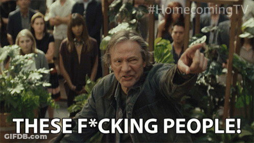 A Man Pointing At A Crowd With The Words These F * Cking People Below Him GIF