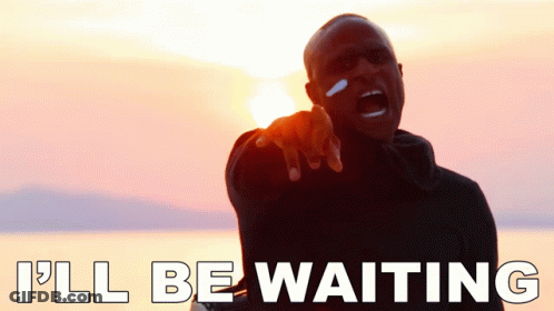 A Man Pointing At The Camera With The Words I 'Ll Be Waiting GIF