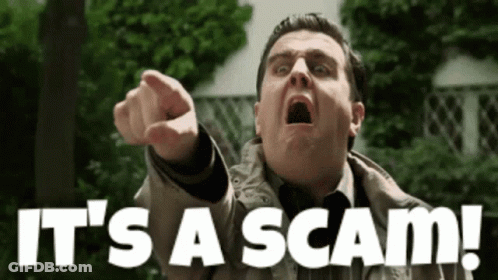 A Man Pointing At The Camera With The Words It 'S A Scam Behind Him GIF
