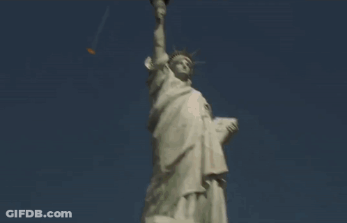 A Man Pointing At The Twin Towers In New York GIF