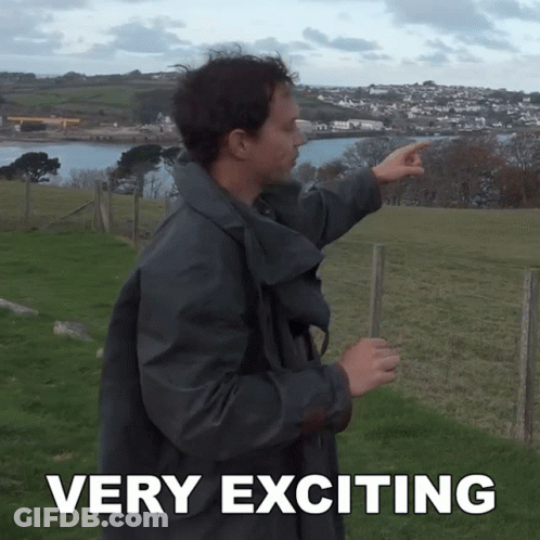 A Man Pointing In A Field With The Words Very Exciting Written Below Him GIF