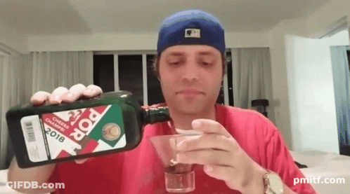 A Man Pouring A Martini From A Bottle That Says Pop On It GIF