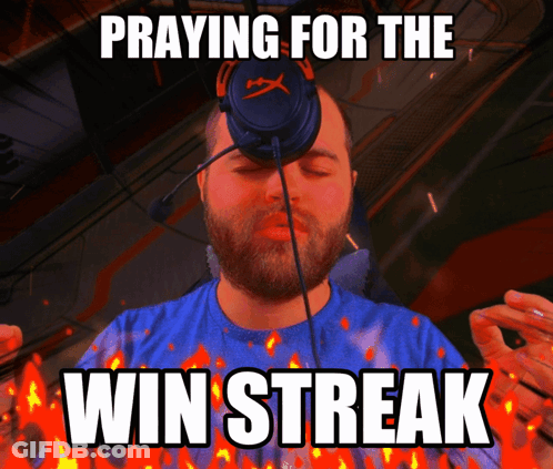 A Man Praying For The Win Streak With Flames Around Him GIF