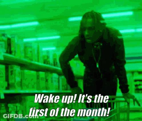 A Man Pushing A Shopping Cart With The Words Wake Up It 'S The First Of The Month Written Below Him GIF