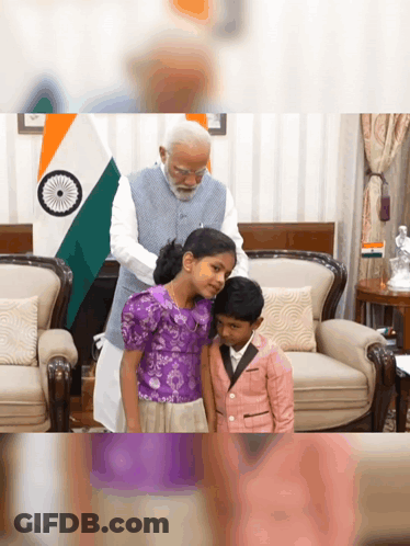 A Man Putting A Purple Shirt On A Little Girl GIF
