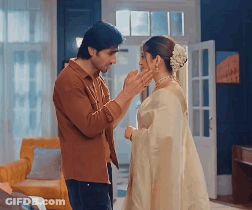 A Man Putting A Ring On A Woman 'S Nose GIF