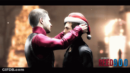 A Man Putting A Santa Hat On Another Man 'S Head With Reed900 Written On The Bottom Right GIF