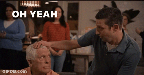 A Man Putting His Hand On An Older Man 'S Forehead With The Words Oh Yeah Above Him GIF