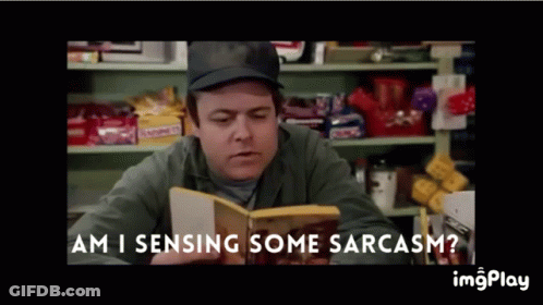 A Man Reading A Book With The Words Am I Sensing Some Sarcasm On The Bottom GIF