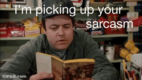 A Man Reading A Book With The Words " I 'M Picking Up Your Sarcasm " Behind Him GIF