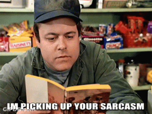 A Man Reading A Book With The Words Im Picking Up Your Sarcasm GIF