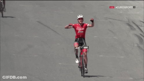 A Man Riding A Bike With The Word Trek On The Front GIF