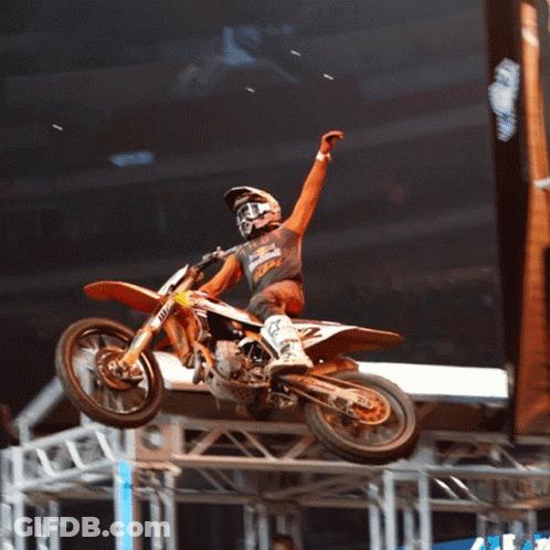 A Man Riding A Dirt Bike With The Number 2 On The Back GIF