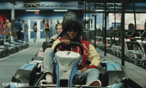 A Man Riding A Go Kart With The Number 7 On The Front GIF
