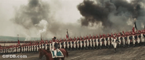 A Man Riding A Horse Leads A Large Military Parade GIF