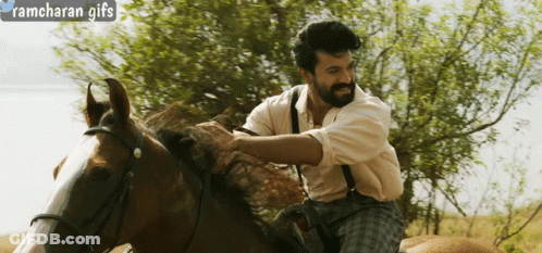 A Man Riding A Horse With Ramcharan Gifs Written In The Corner GIF