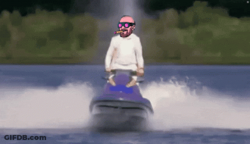 A Man Riding A Jet Ski In The Water With A Cigar In His Mouth GIF