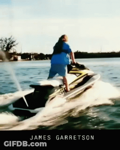 A Man Riding A Jet Ski In The Water With The Name James Garratson GIF