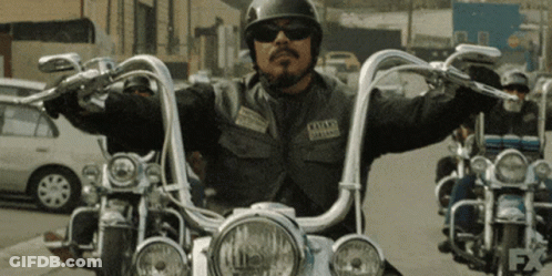 Man Riding Motorcycle With Los Santos Patch GIF