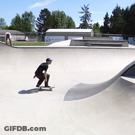 A Man Riding A Skateboard In A Skate Park GIF