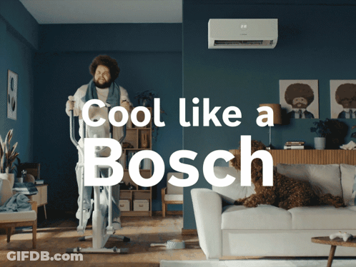 A Man Riding An Elliptical In A Living Room With The Words Cool Like A Bosch GIF