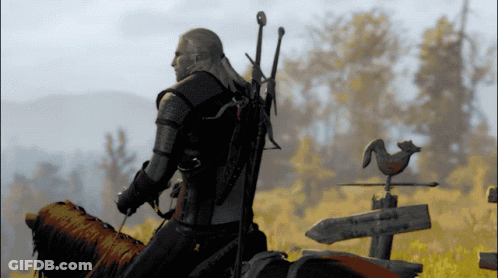 A Man Riding On The Back Of A Horse With A Sword On His Back GIF
