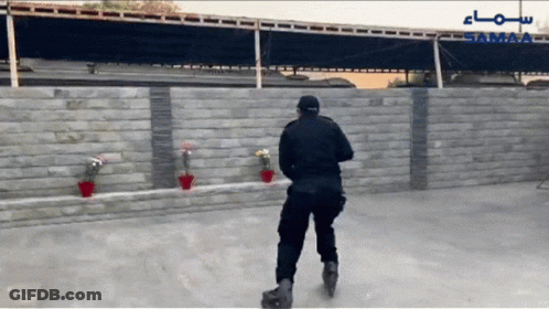 A Man Rollerblading In Front Of A Wall With The Word Samaa On It GIF