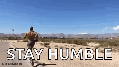 A Man Running Down A Road With The Words " Stay Humble " Written On It GIF