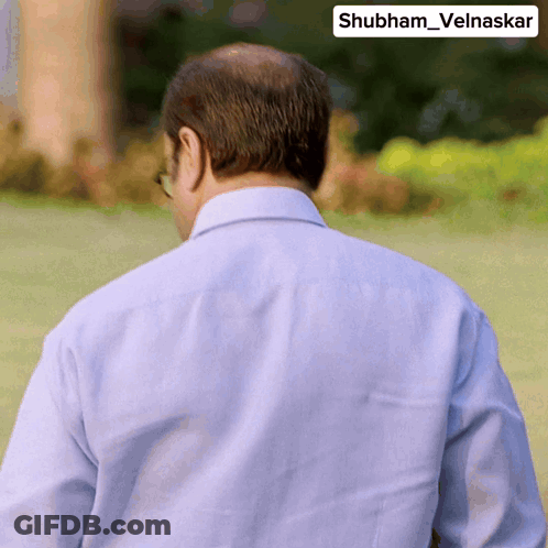 A Man 'S Back Is Shown With The Name Shubham Velnaskar On The Corner GIF