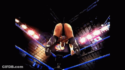 A Man 'S Butt Is Shown In A Wrestling Ring With Blue Ropes GIF