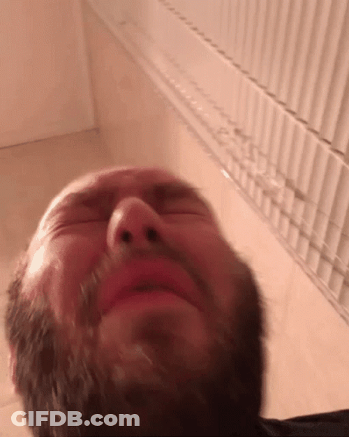 A Man's Close Up Sneeze GIF
