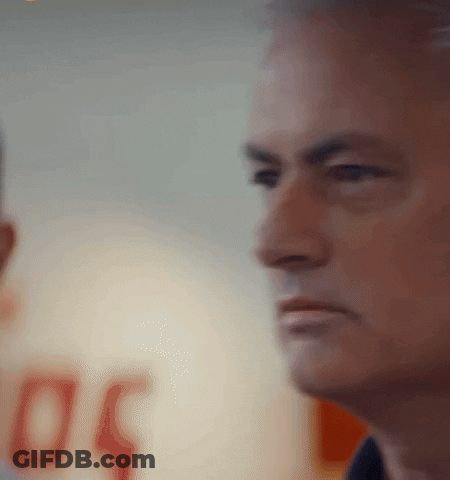 A Man 'S Face Is Shown In A Blurry Photo With The Number 50 In The Background GIF