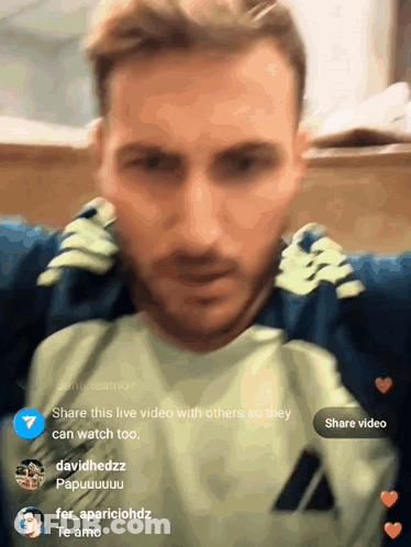 A Man 'S Face Is Shown In A Blurry Photo With The Words Share This Live Video With Others So They Can Watch GIF