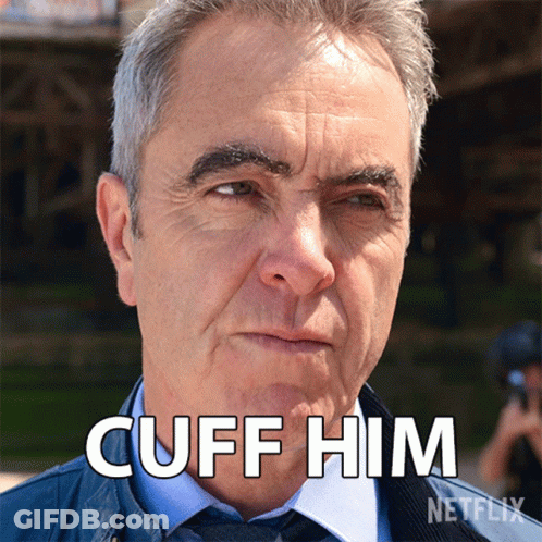 A Man 'S Face Is Shown With The Words " Cuff Him " Above Him GIF