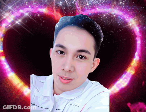A Man 'S Face Is Surrounded By A Heart Shaped Background GIF