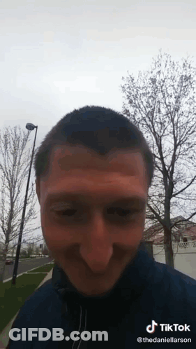 A Man 'S Face Is Visible In A Tik Tok Video GIF