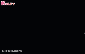 A Man 'S Face Is Visible In The Dark With A Smile On His Face . GIF