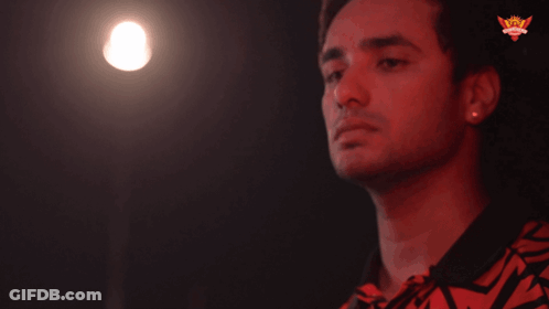 A Man 'S Finger Is Pointing At A Light That Says Wow On The Bottom GIF