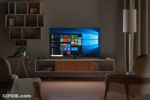 A Man 'S Hand Is Pointing At A Computer Screen That Says Surface GIF